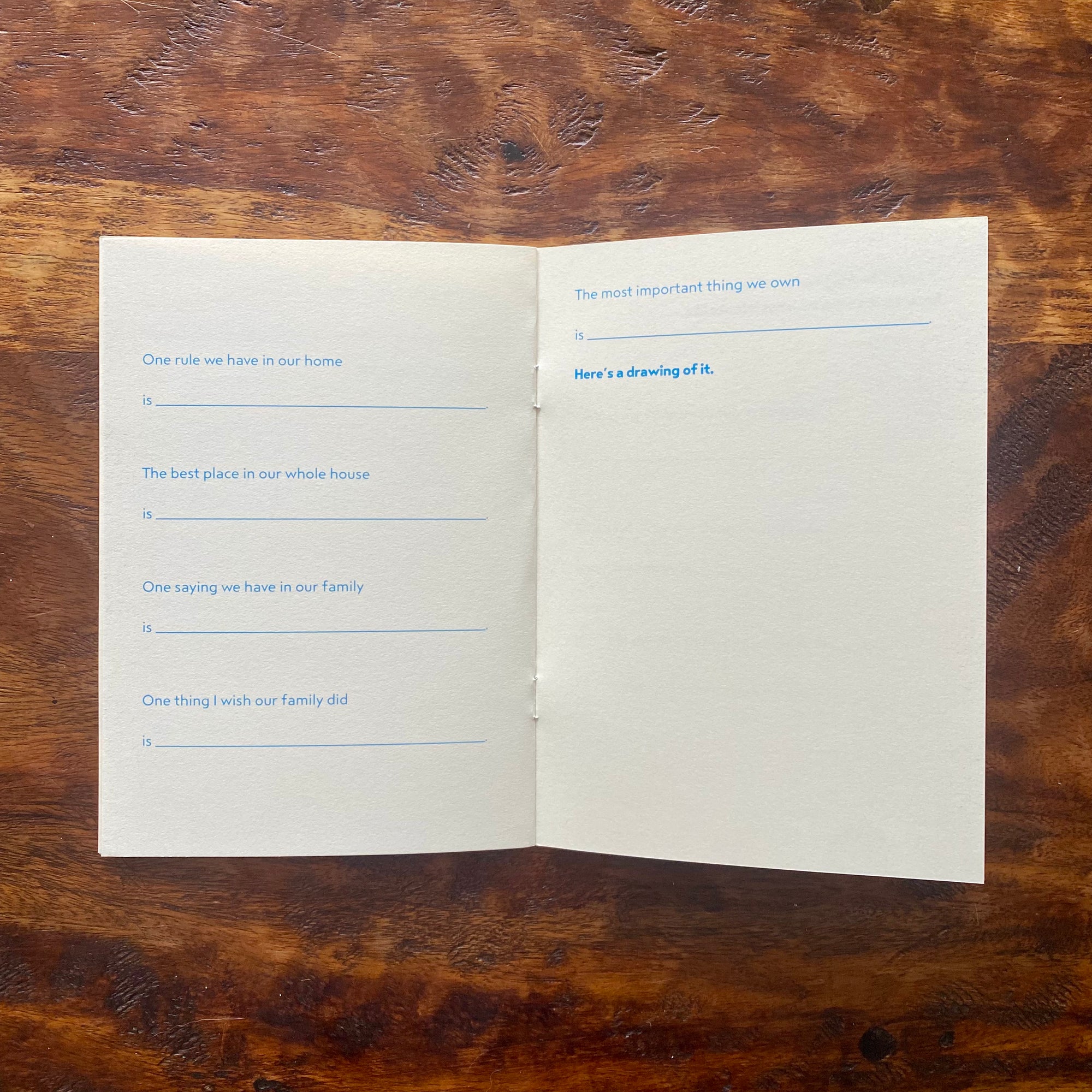 Open book with questionnaire on a wooden surface