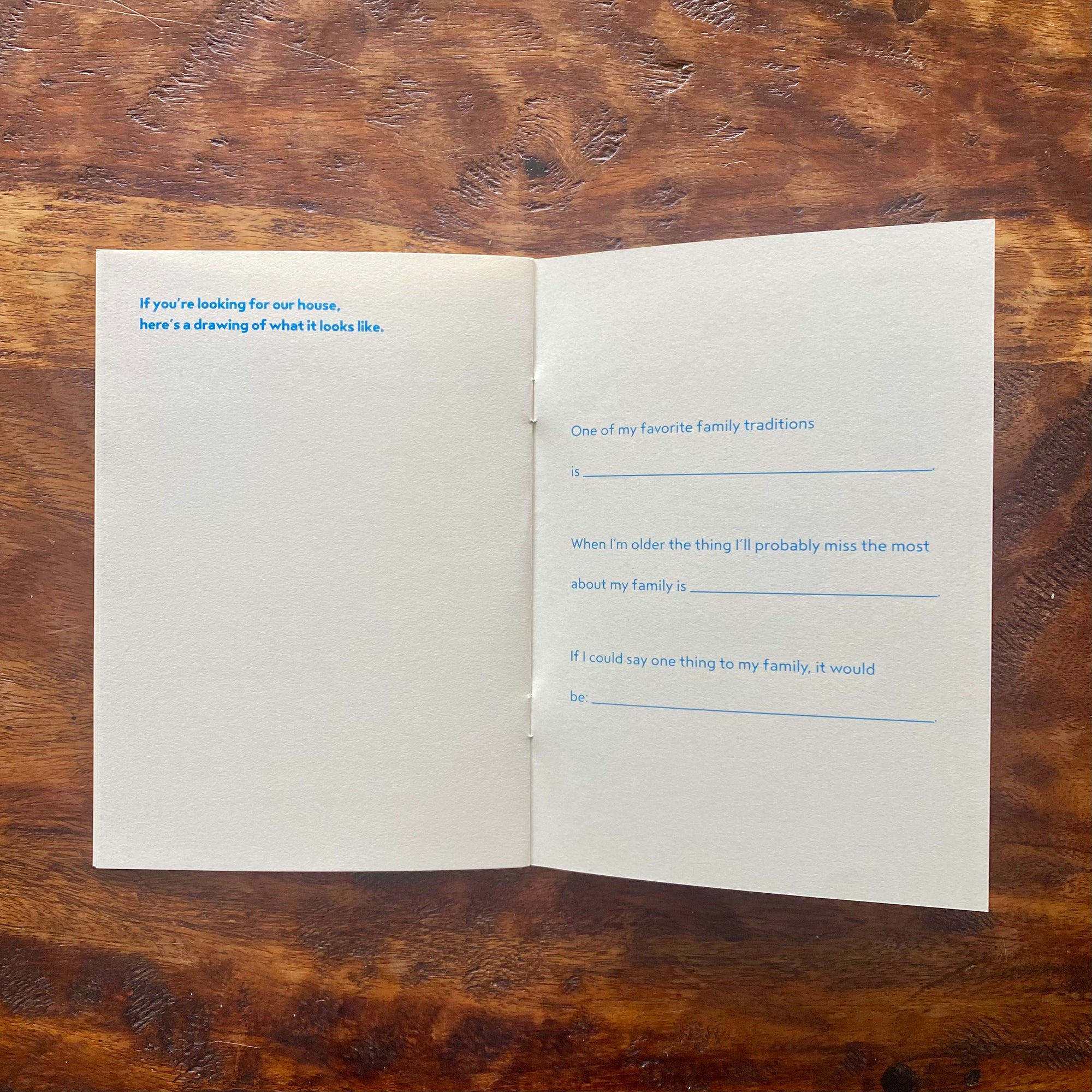 Open book with printed text on a wooden surface
