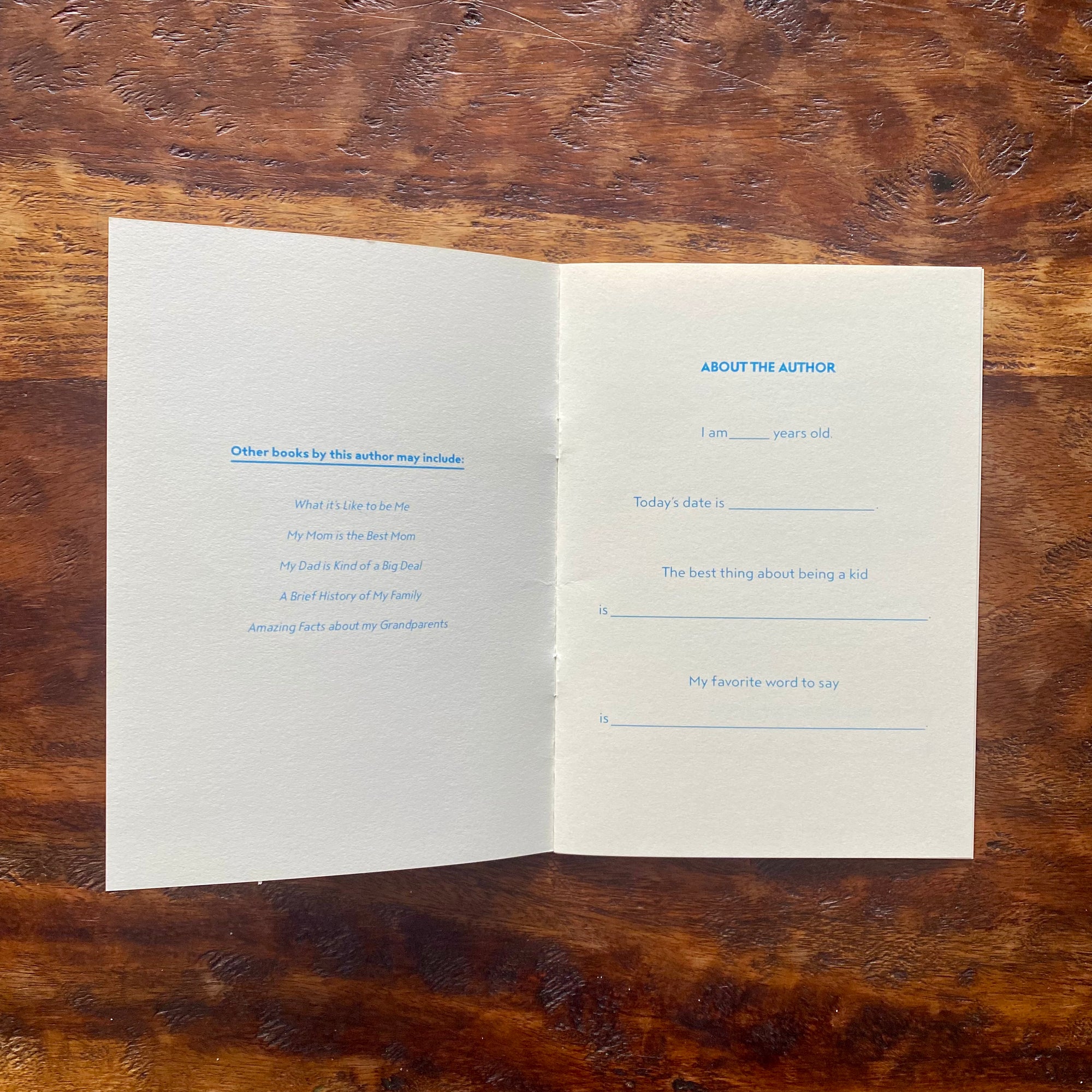 Open book with printed text on a wooden surface