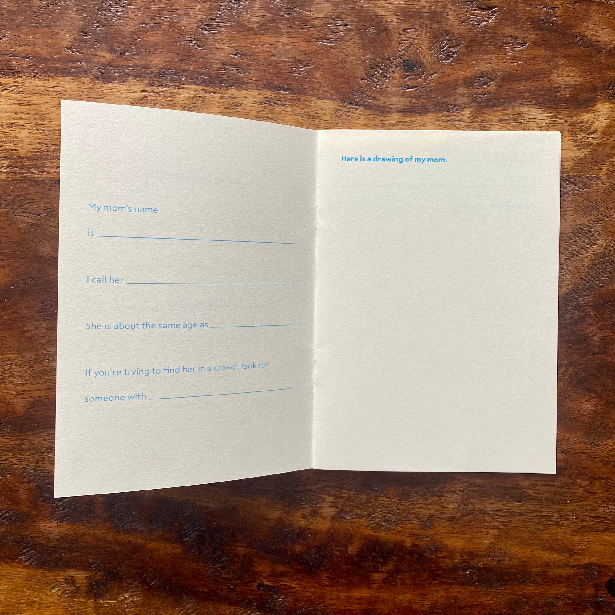 Blank paper with pre-printed text on a wooden surface