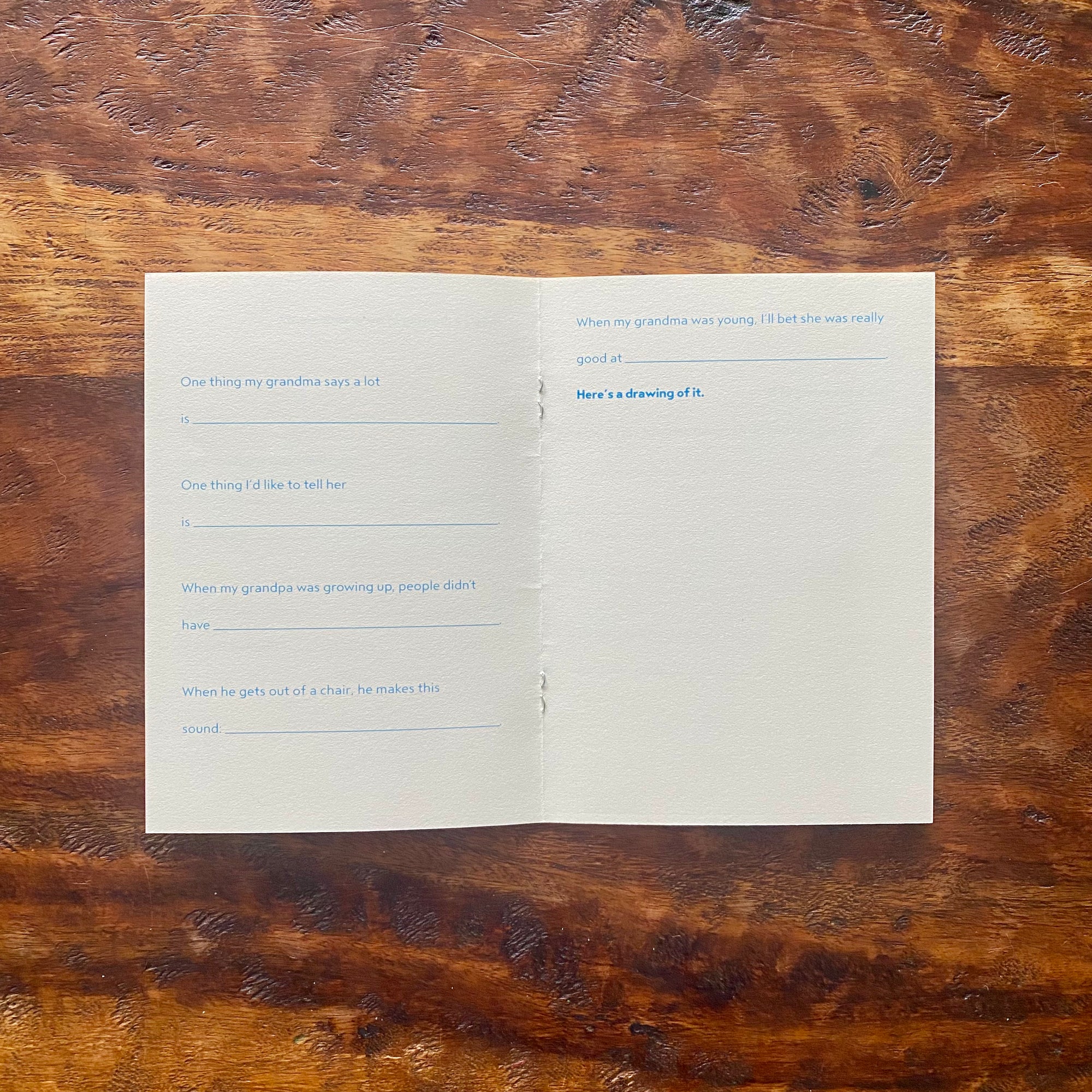 Open book with text on a wooden surface