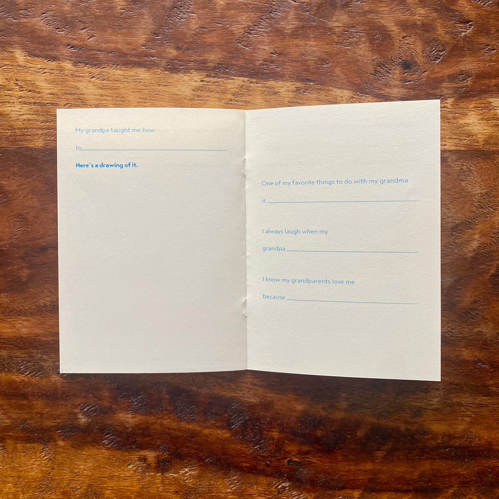 Open book with text on a wooden surface