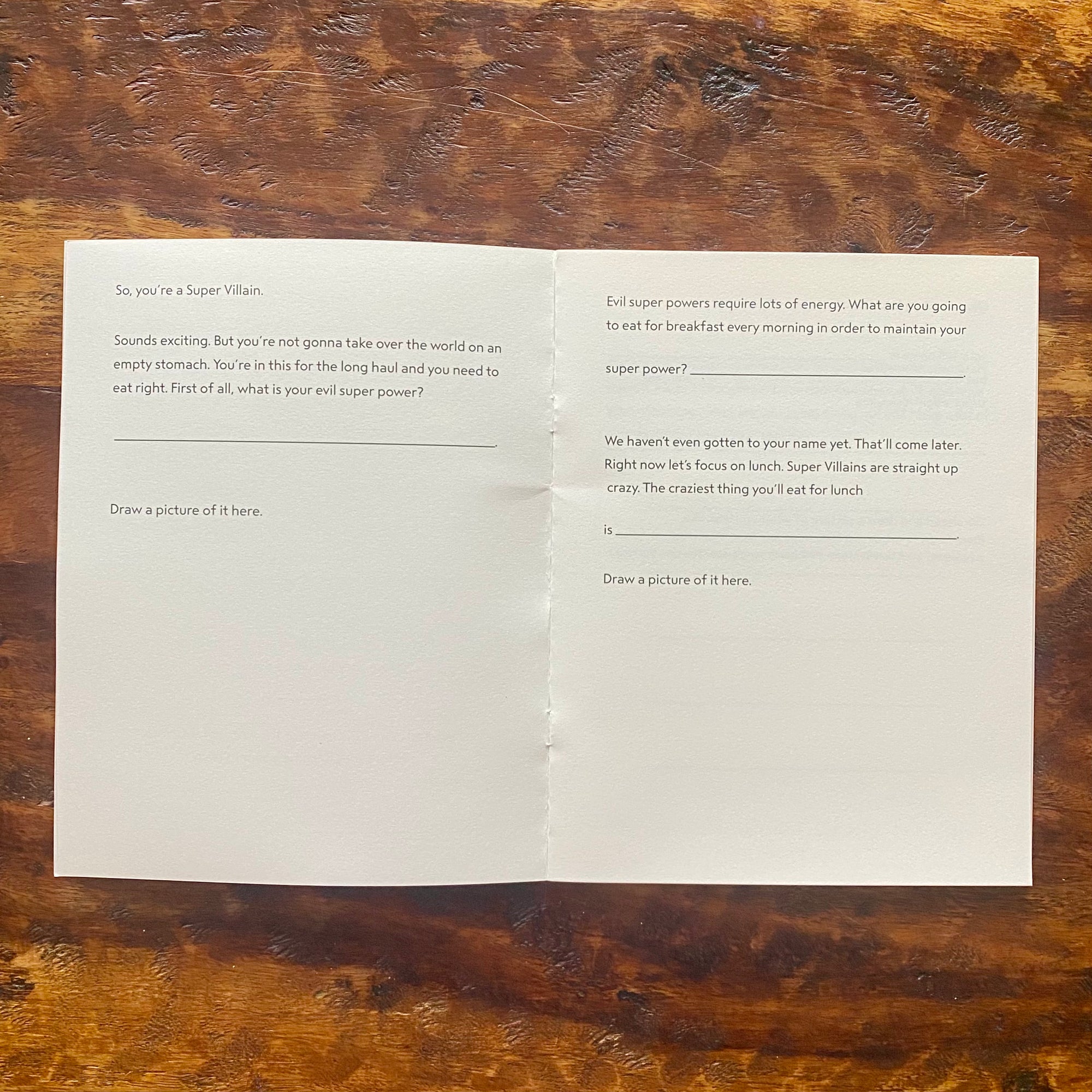 Folded paper with printed text on a wooden surface