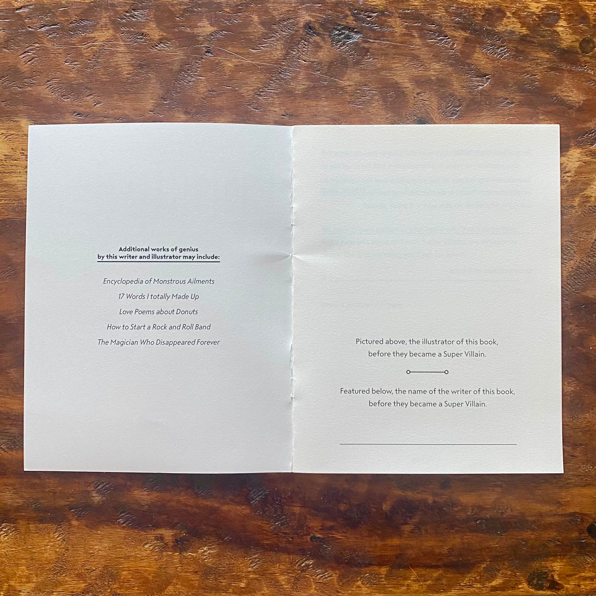 Two pieces of paper with text on a wooden surface