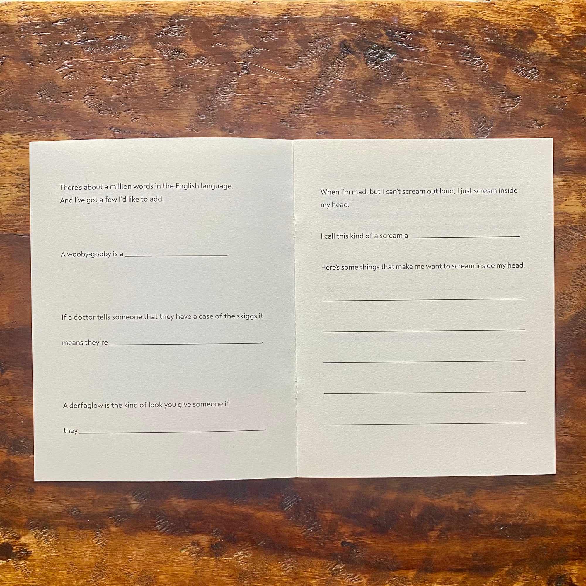 Open book with text on a wooden surface