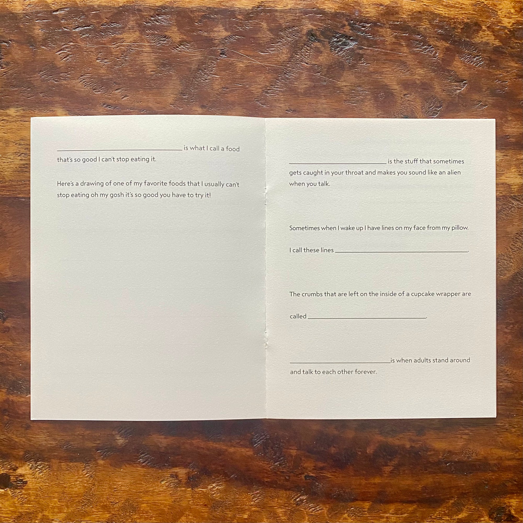 Open book with text on a wooden surface