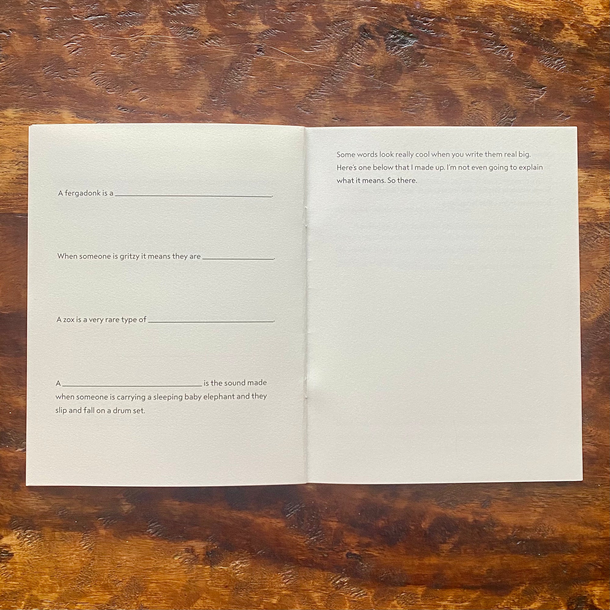 Open book with text on a wooden surface