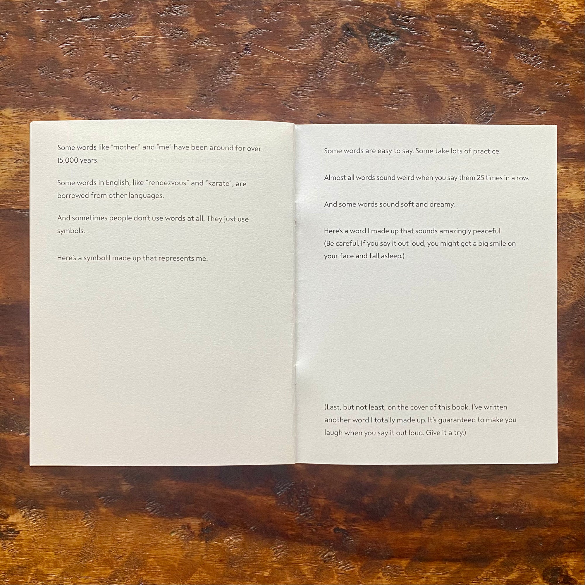 Open book with text on a wooden surface