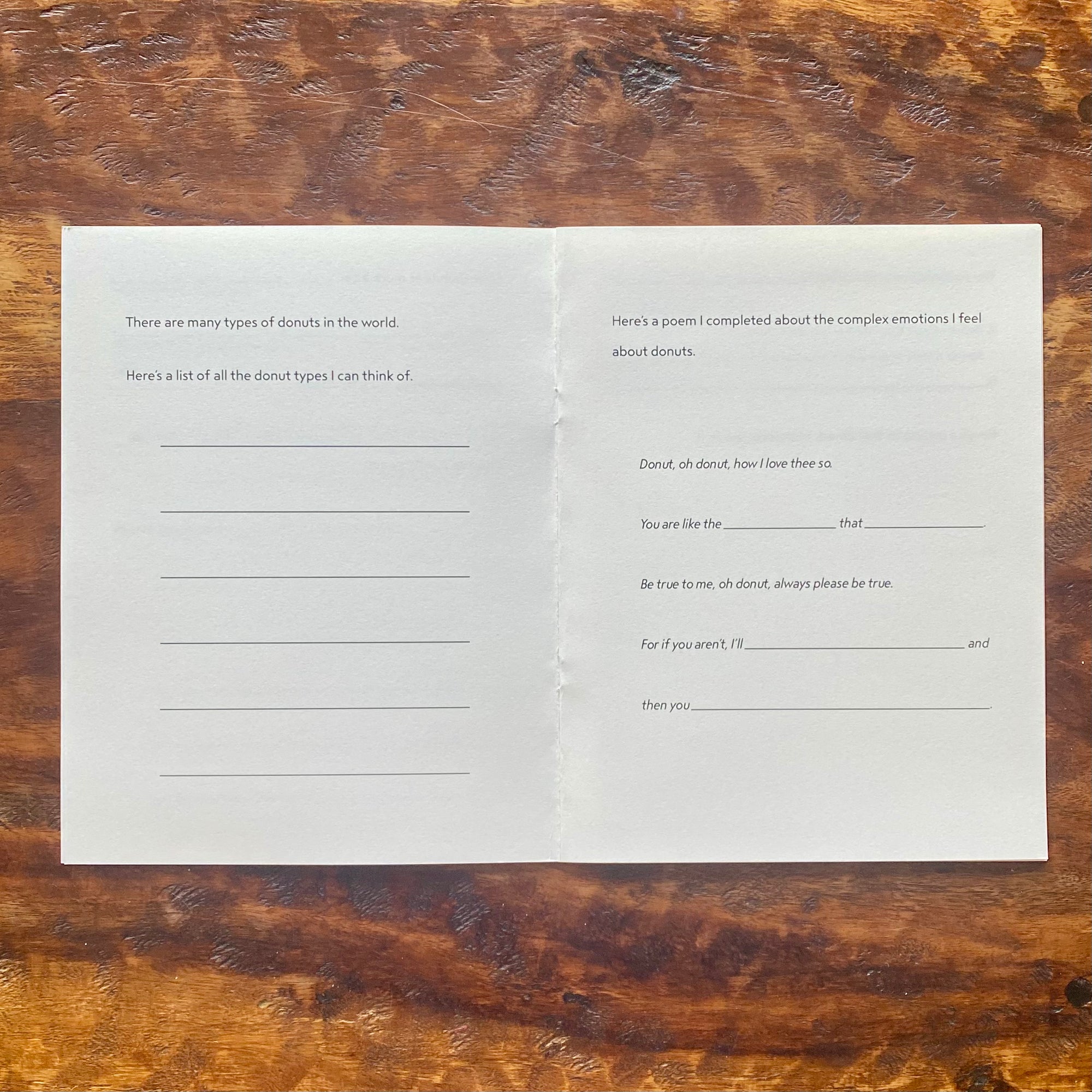 Two sheets of paper with text on a wooden surface