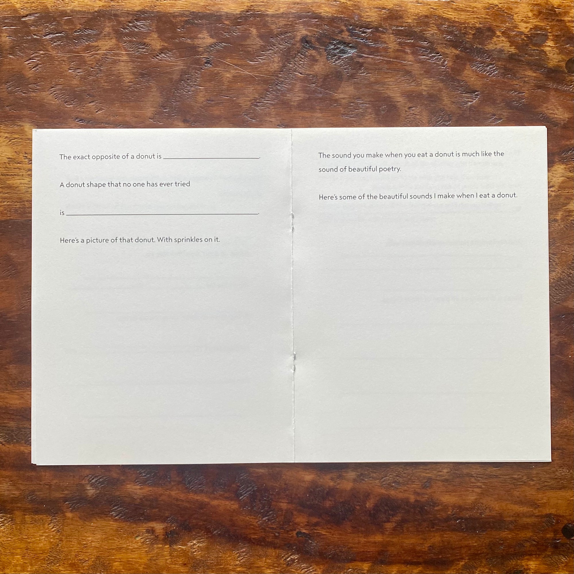 Open book with text on a wooden surface