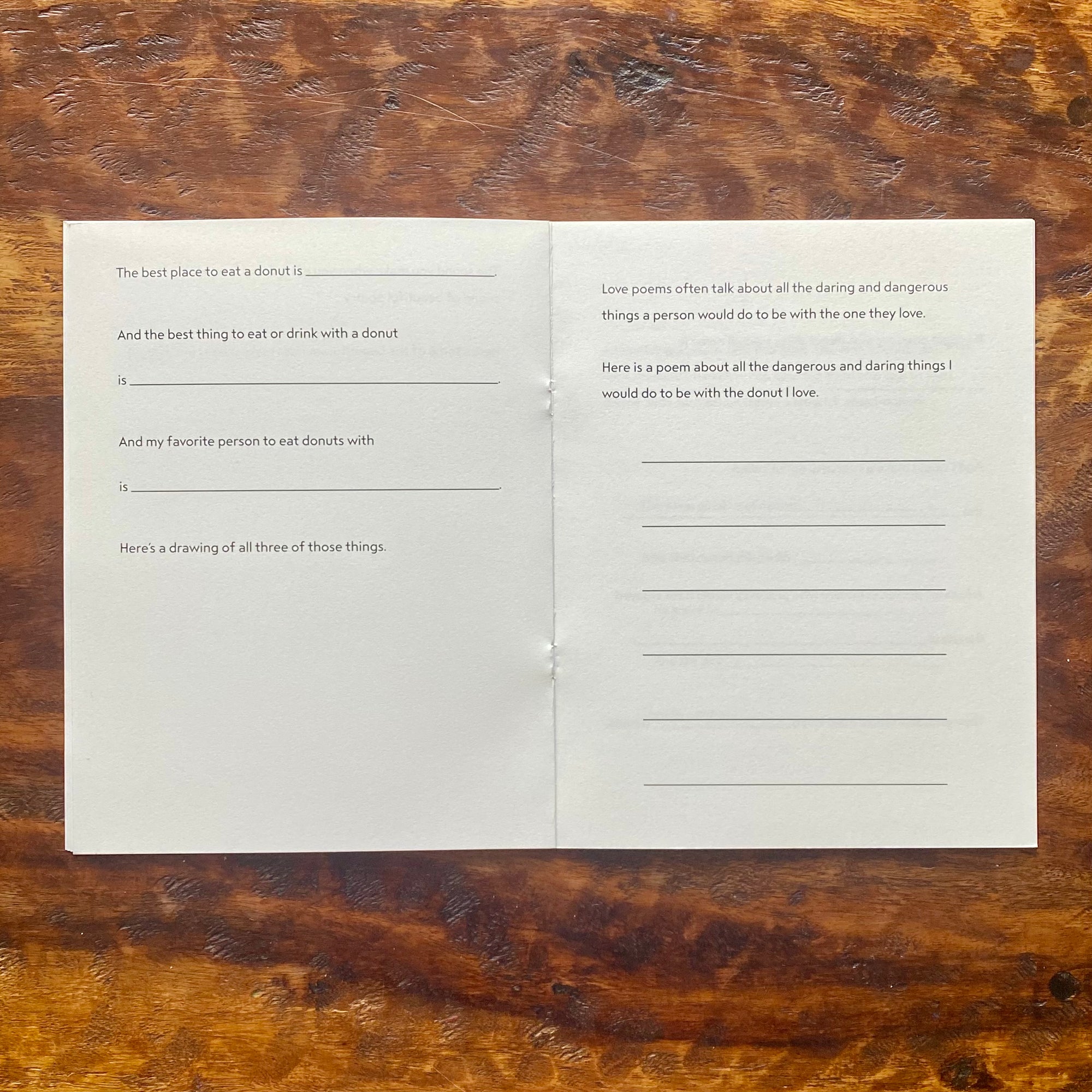 Blank questionnaire book on a wooden surface