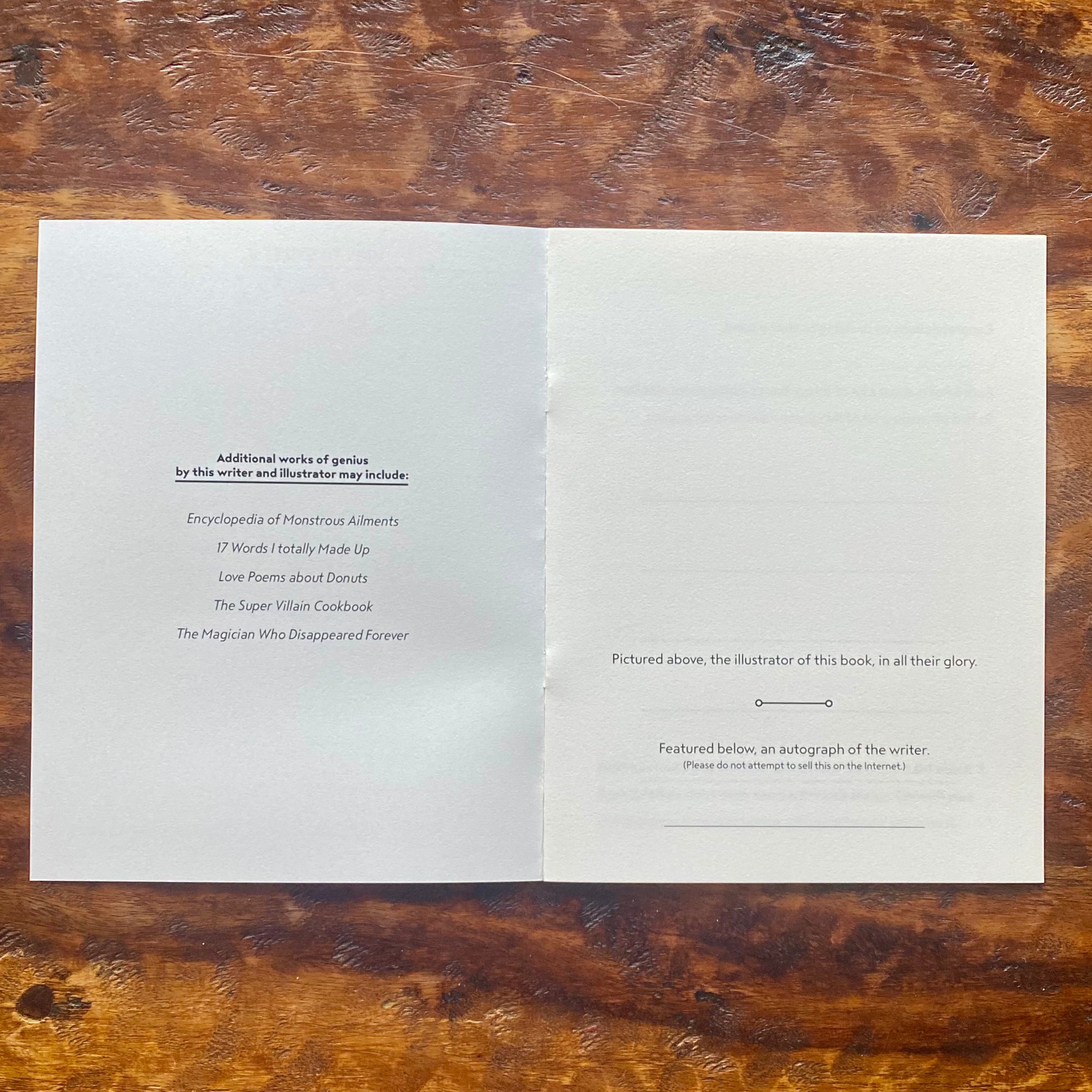Open book with text on a wooden surface