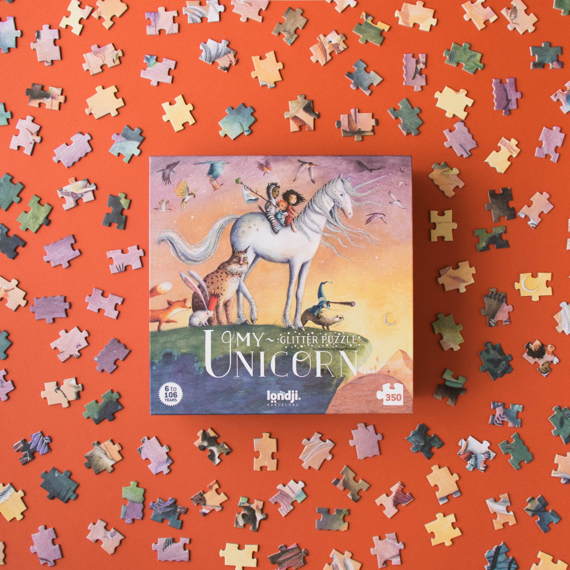 Unfinished puzzle with a box labeled 'My Unicorn' on an orange background