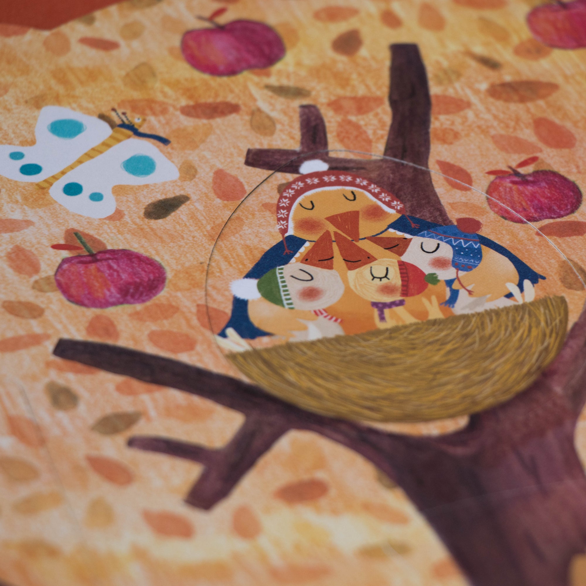 Colorful illustration of a birds in a nest with autumn-themed background