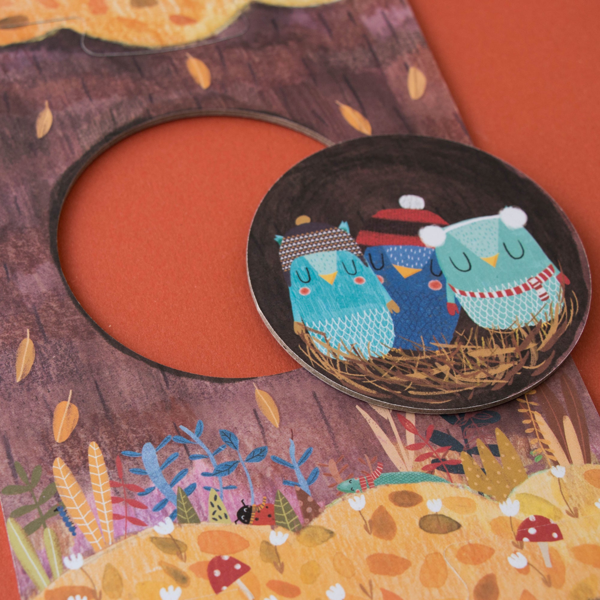 two blue creatures on a brown background