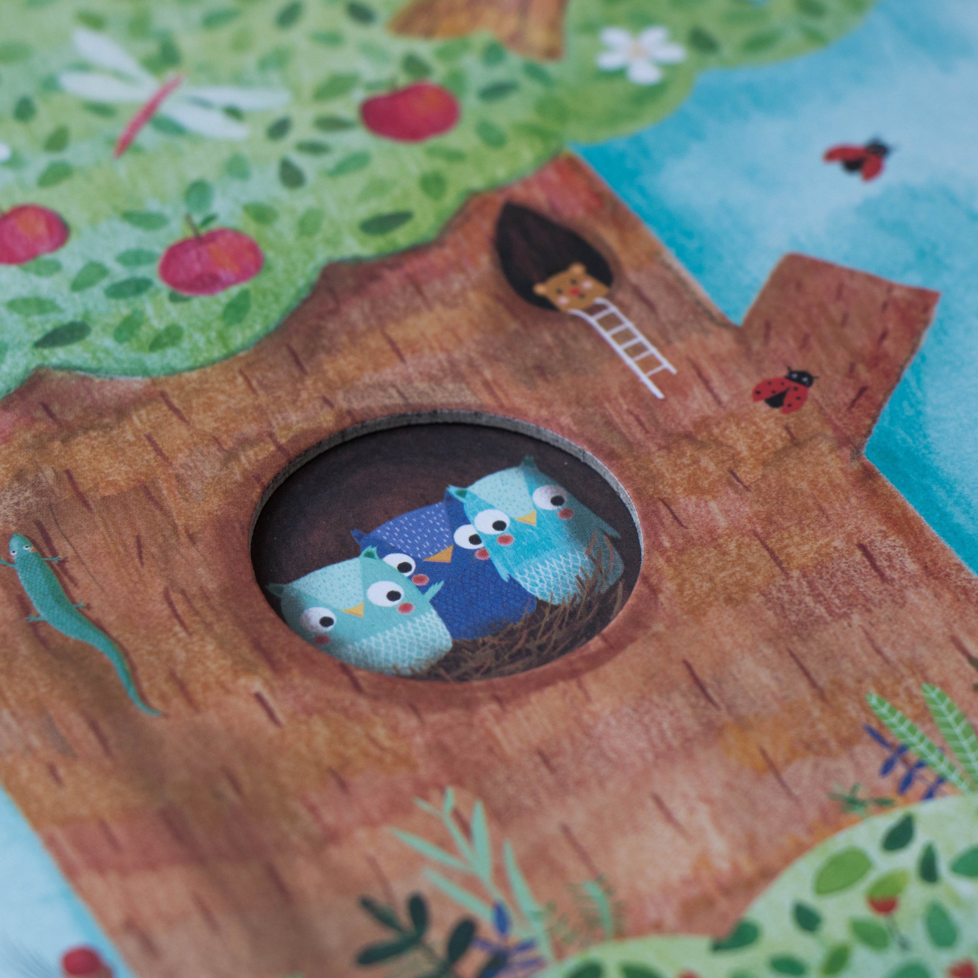 Children's puzzle with a tree and owl illustration