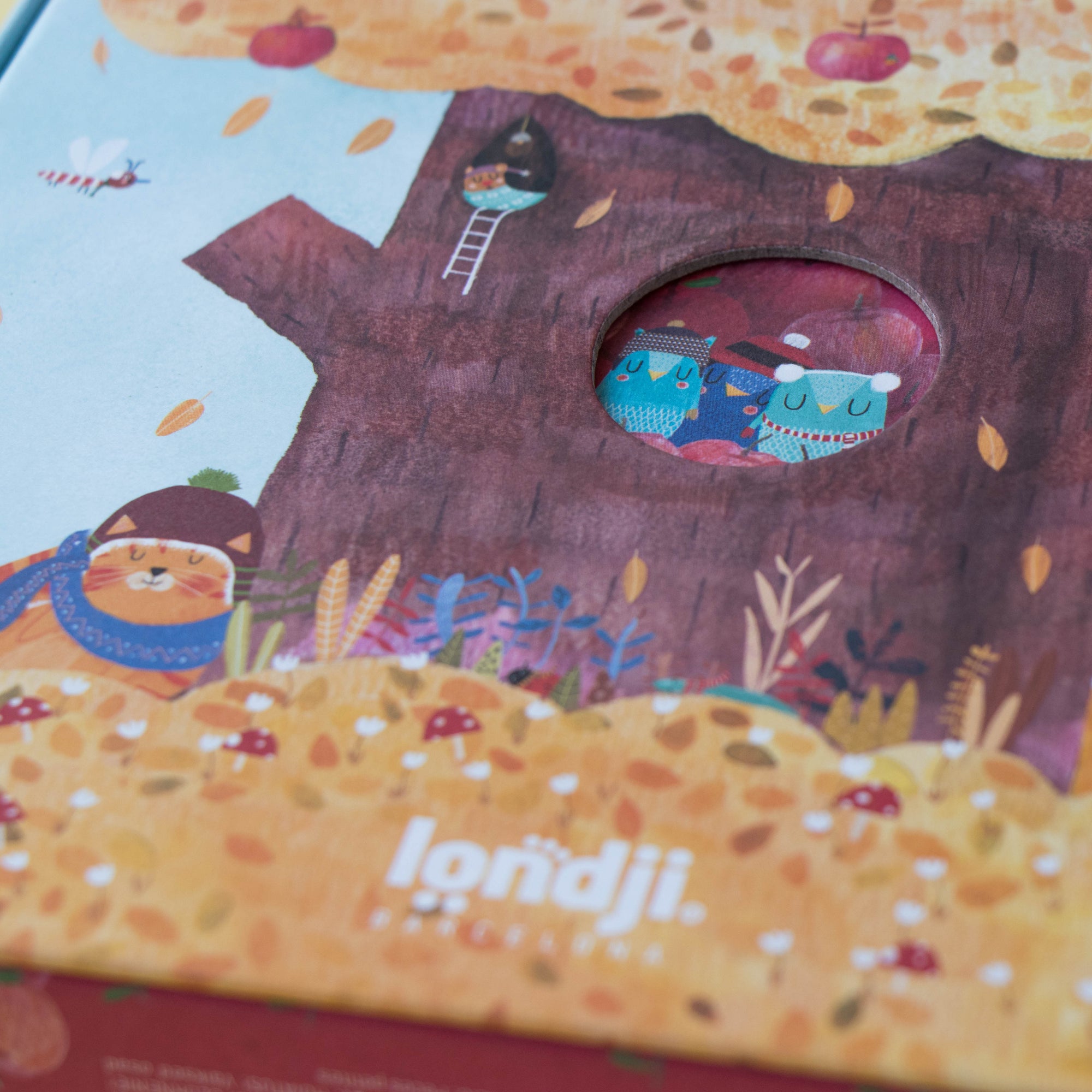 Children's puzzle with a treehouse illustration and 'londji' branding on the cover.
