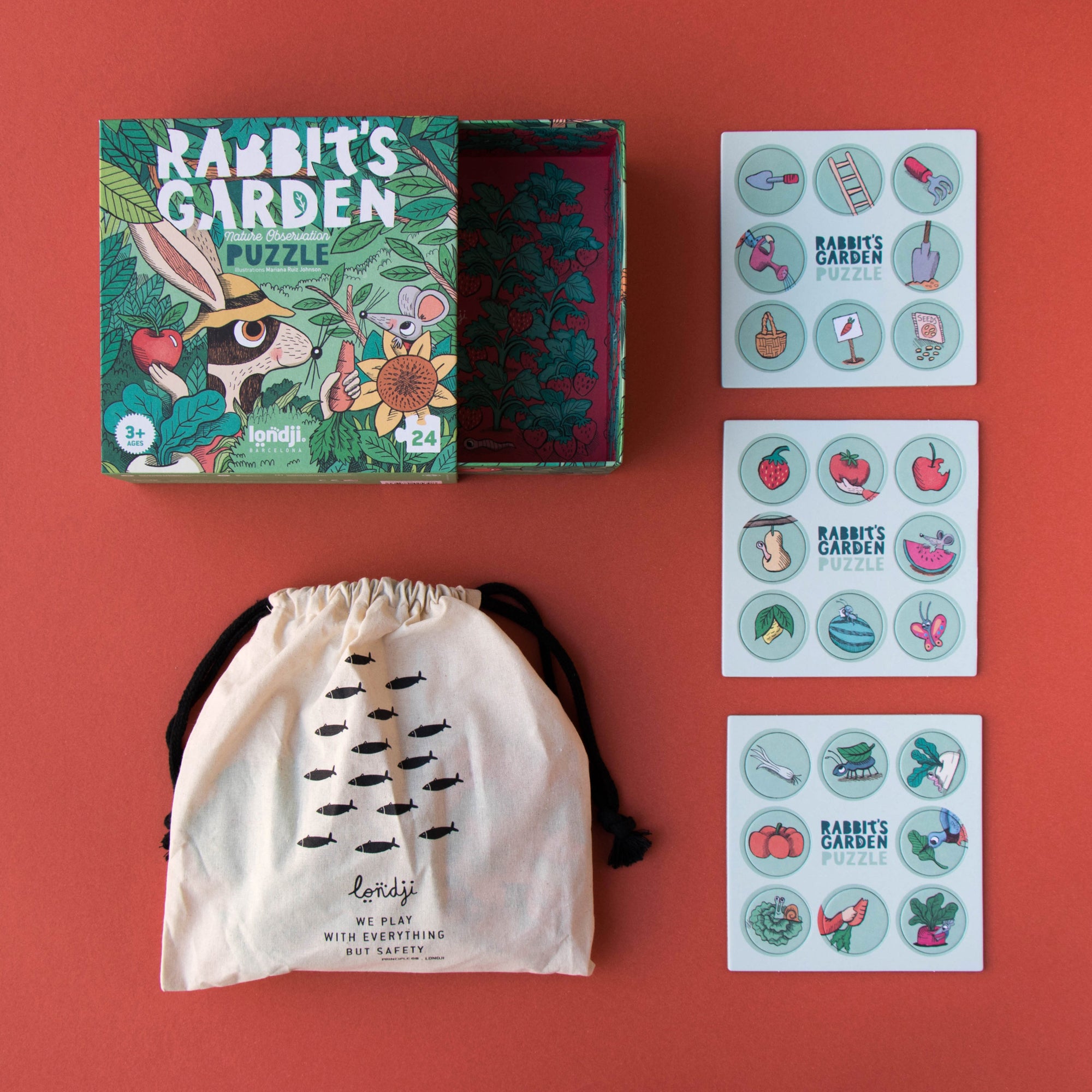 Educational children's products including a puzzle, drawstring bag, and sticker sheets on a red background