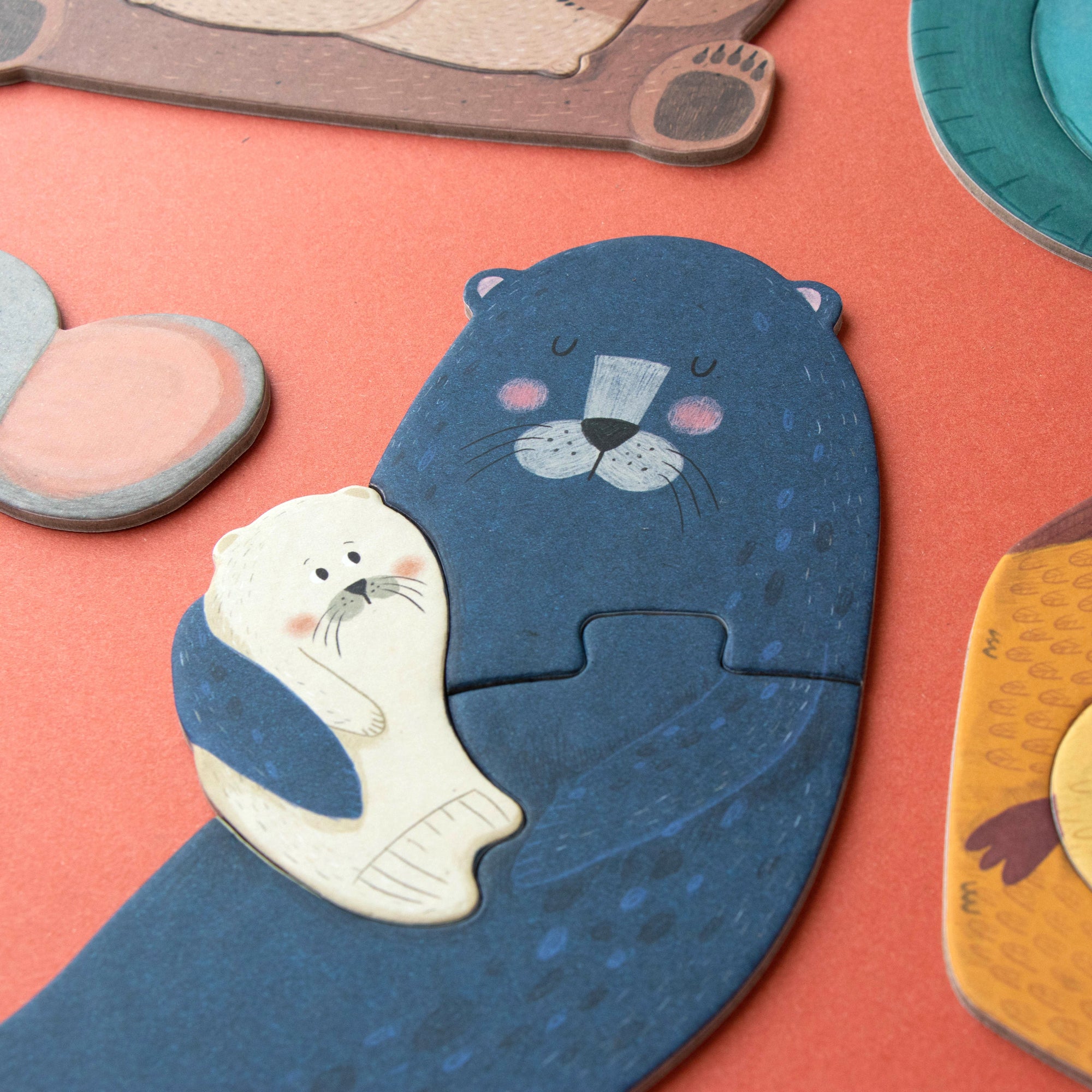 animal puzzle pieces on a red background