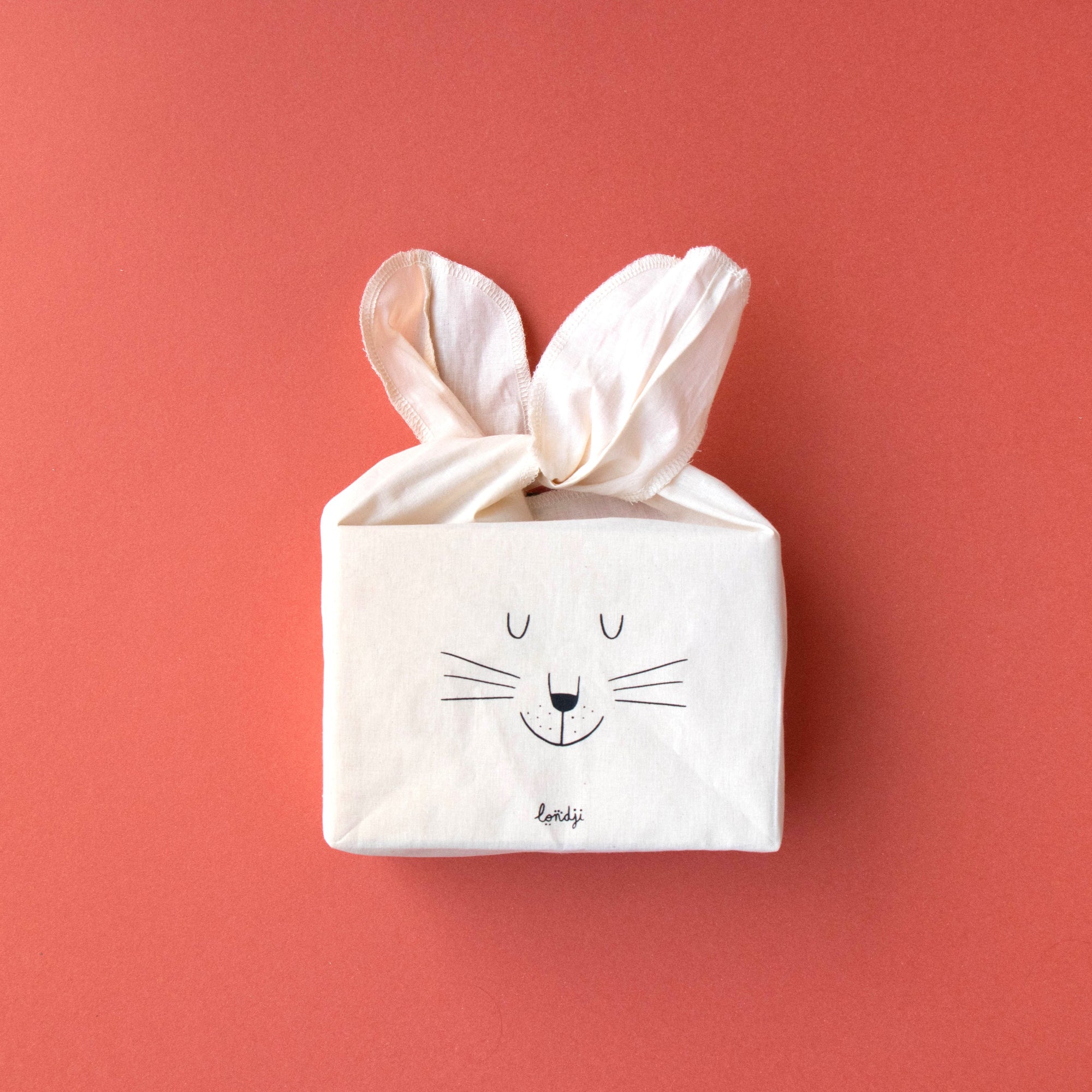 puzzle box with rabbit design on a red background