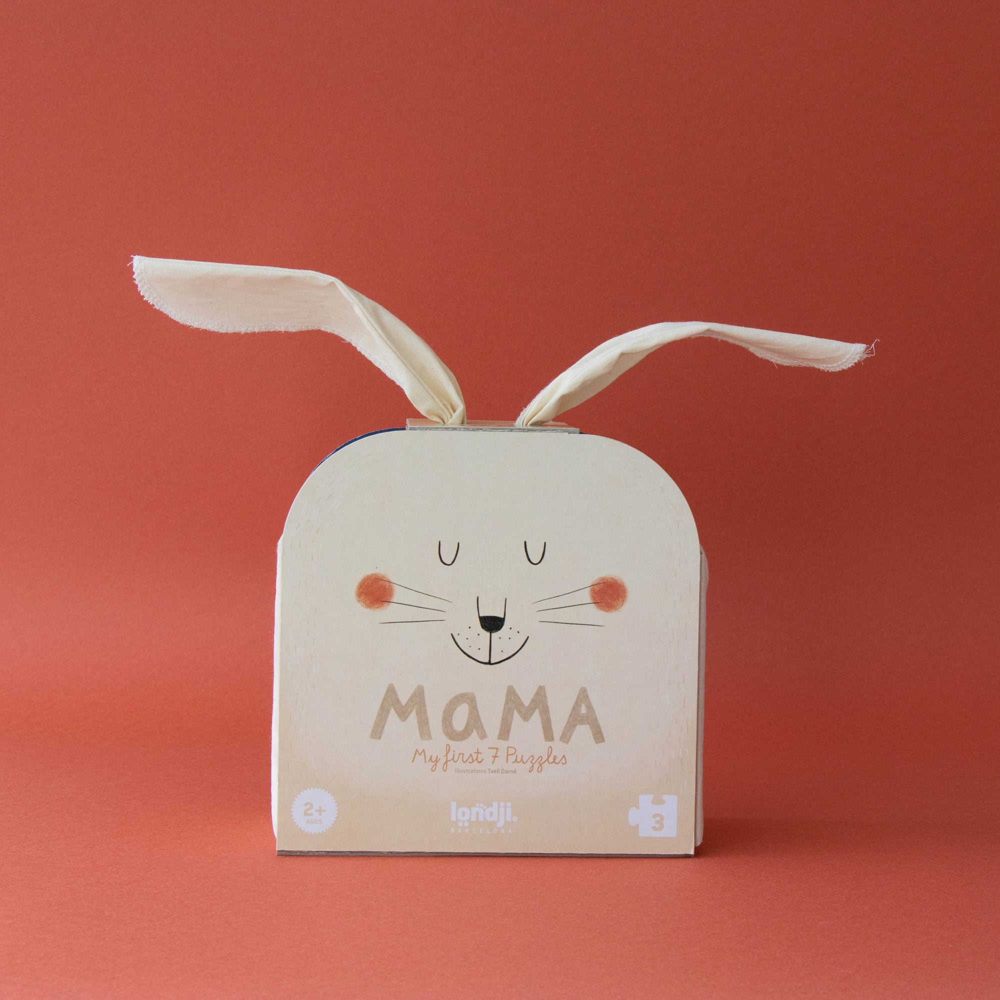 Box with bunny ears and 'MAMA' text on a red background