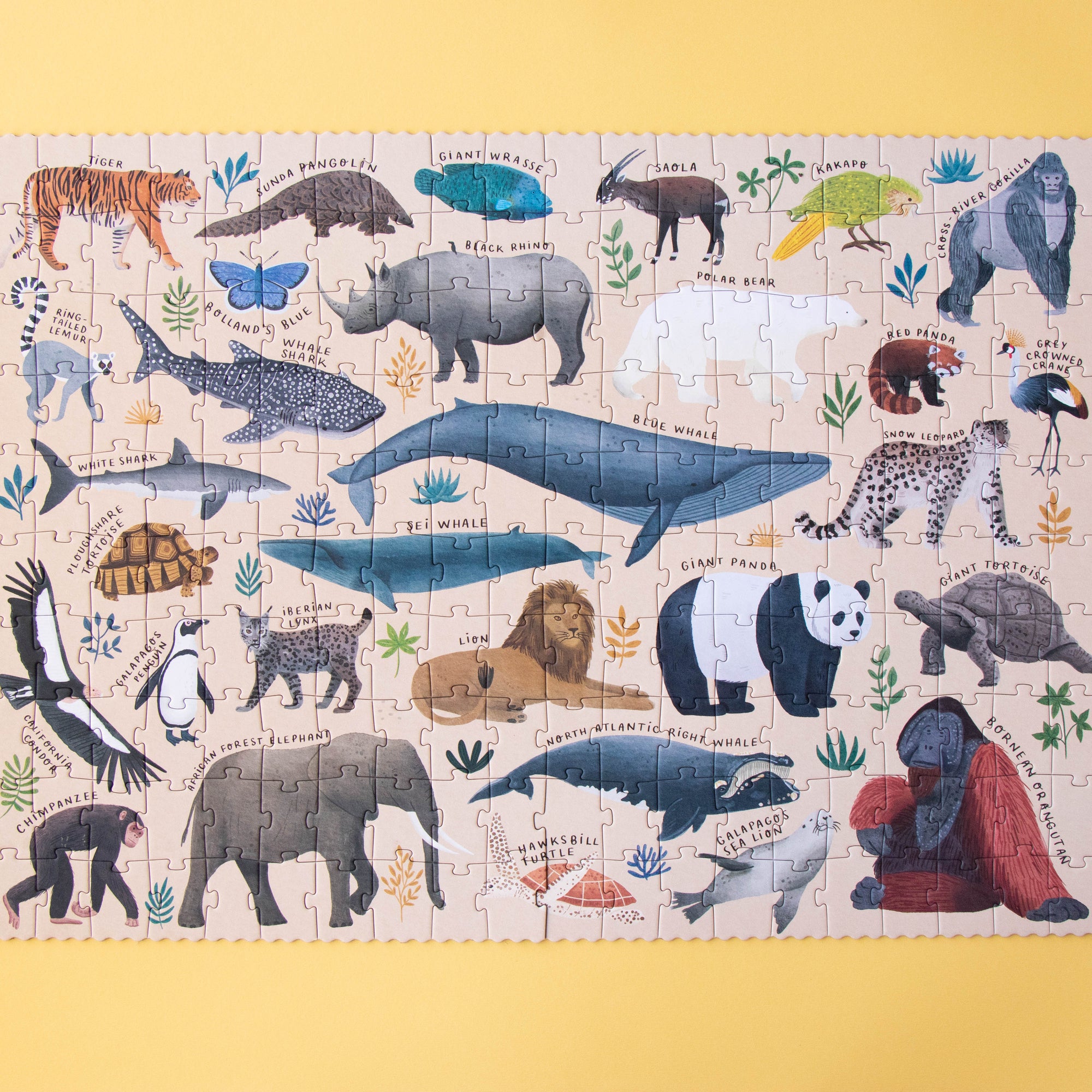Children's puzzle with animal illustrations on a yellow background