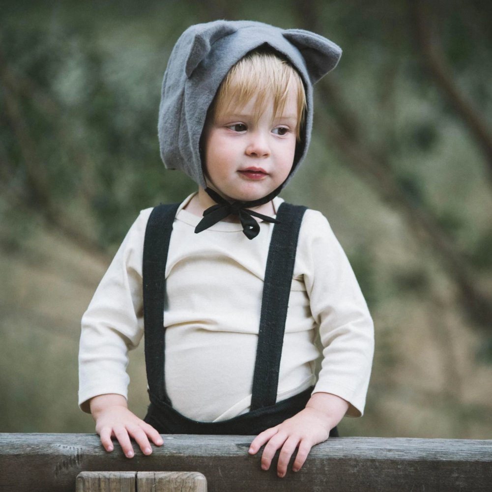 boy wearing grey cat hat