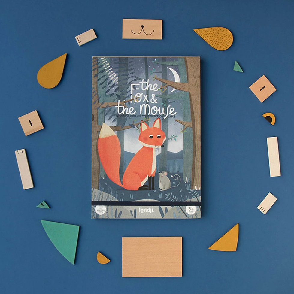 A colorful wooden fox and mouse tanagram game with pieces arranged to form a fox, set against a blue background.