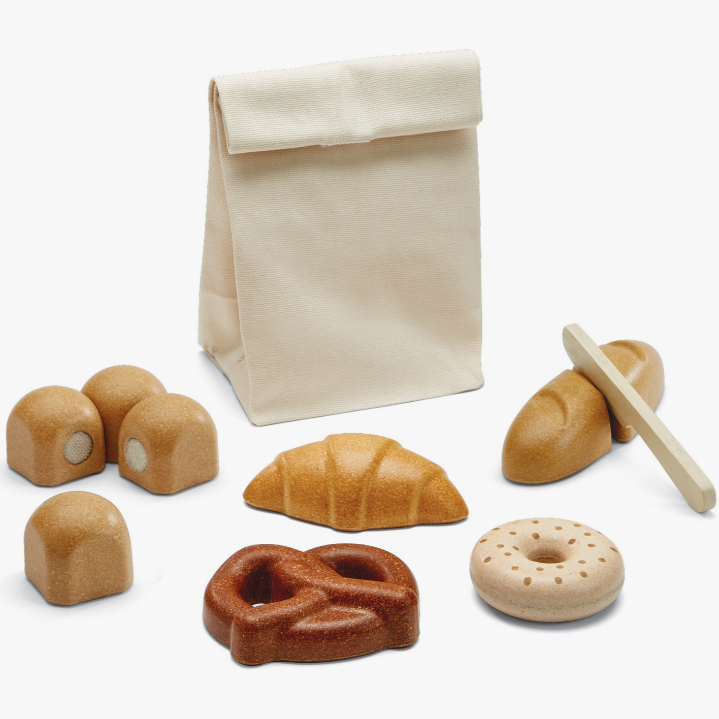 A set of wooden play food items including a bagel, rolls, pretzel, croissant, and a baguette, accompanied by a fabric storage bag and a wooden pretend-play knife.