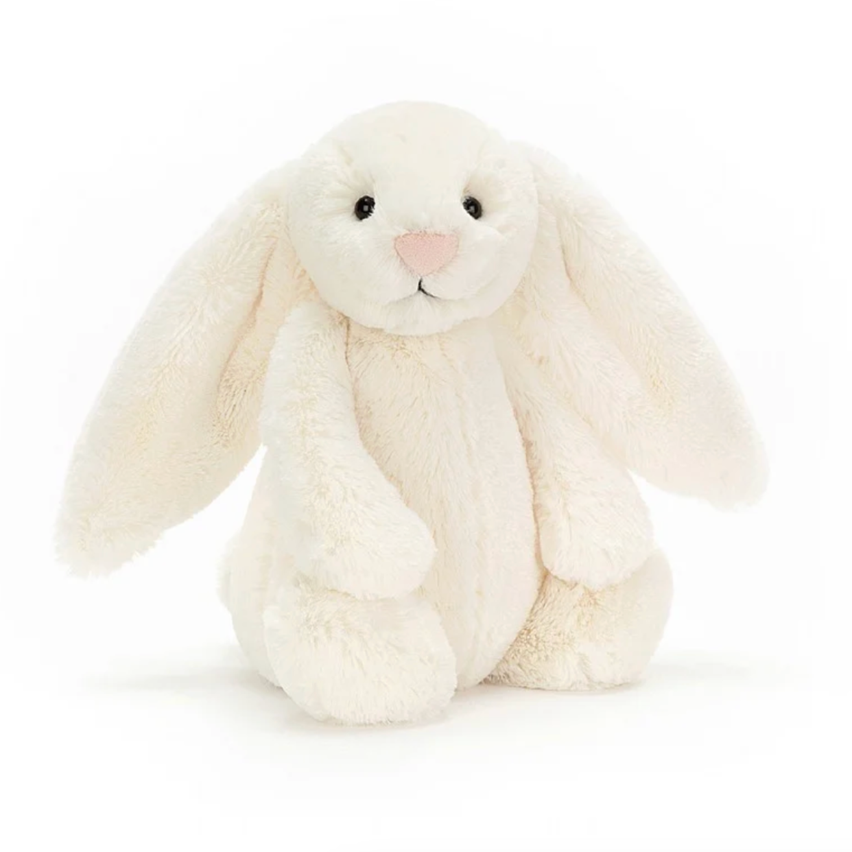 A soft, cream-colored stuffed bunny with long ears and a gentle expression, standing against a white background.