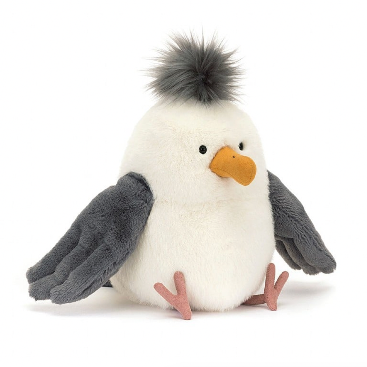 A plush toy resembling a seagull with soft cream fur, dark grey wings, thin suedette legs, and a dark grey tuft on its head. It has a curved mustard suedette beak.