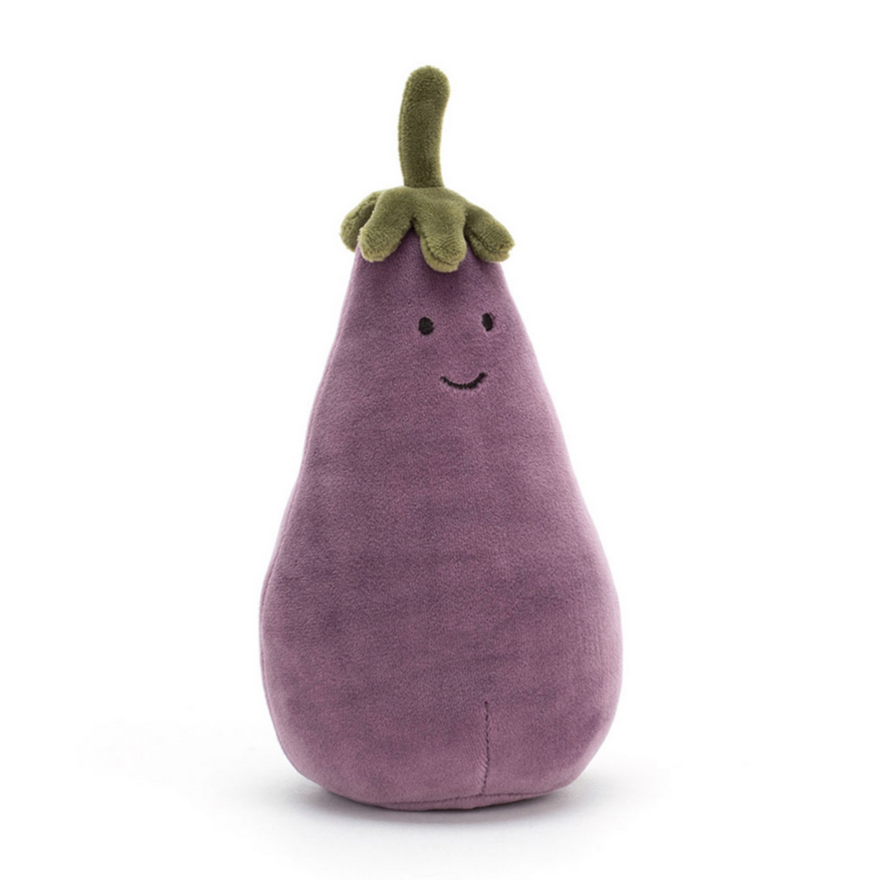 A plush toy resembling an eggplant with a green stalk and a smiling face.