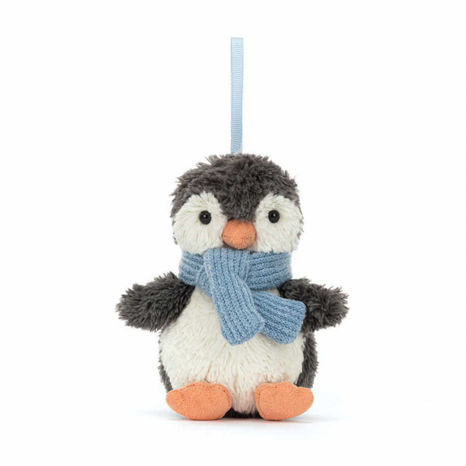A plush toy resembling a penguin with blue-black fur, a vanilla tummy, and a blue corduroy scarf. It has orange suedette feet and beak.