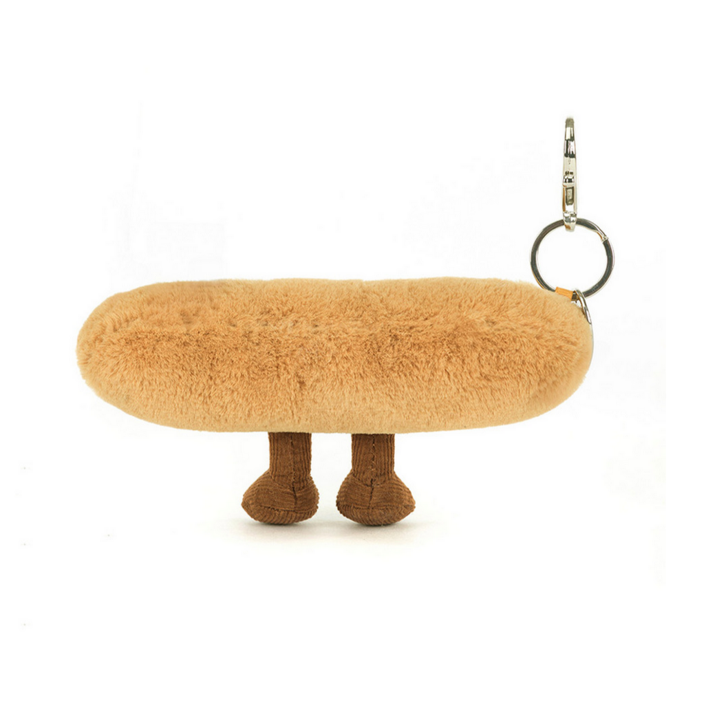 Furry mushroom-shaped keychain on a white background