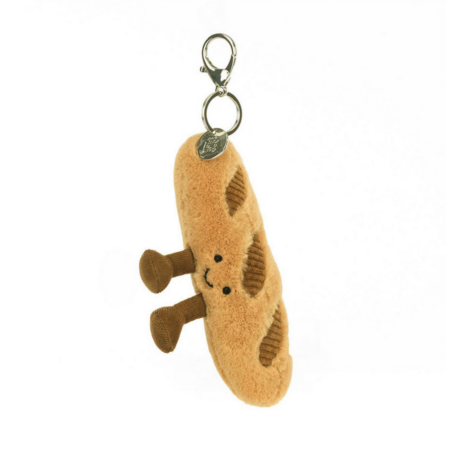 Plush baguette charm with a keyring on a white background