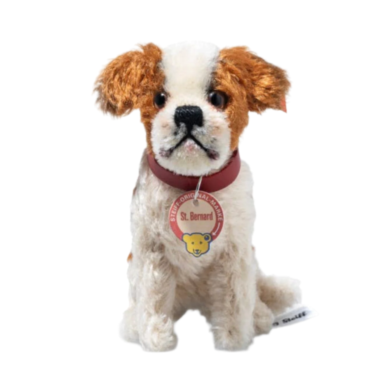 Stuffed dog toy with a red collar on a white background