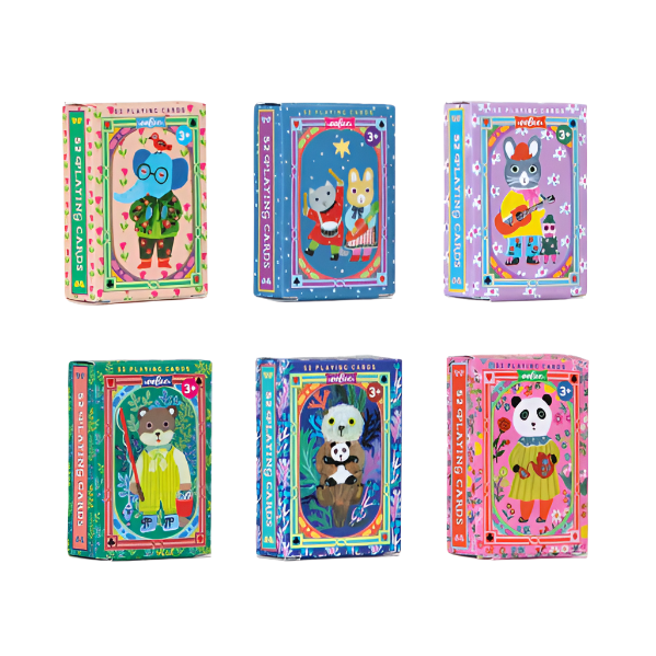 Colorful card packs with cartoon characters on a wooden surface