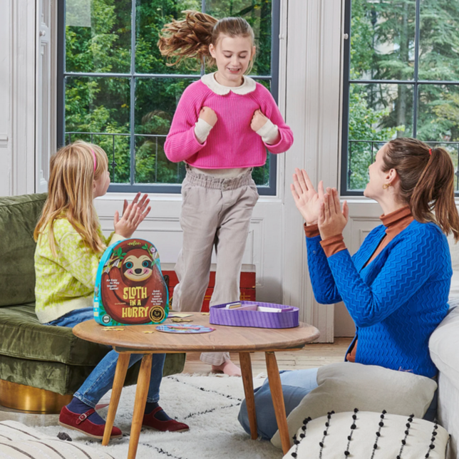 Children playing a game in a living room