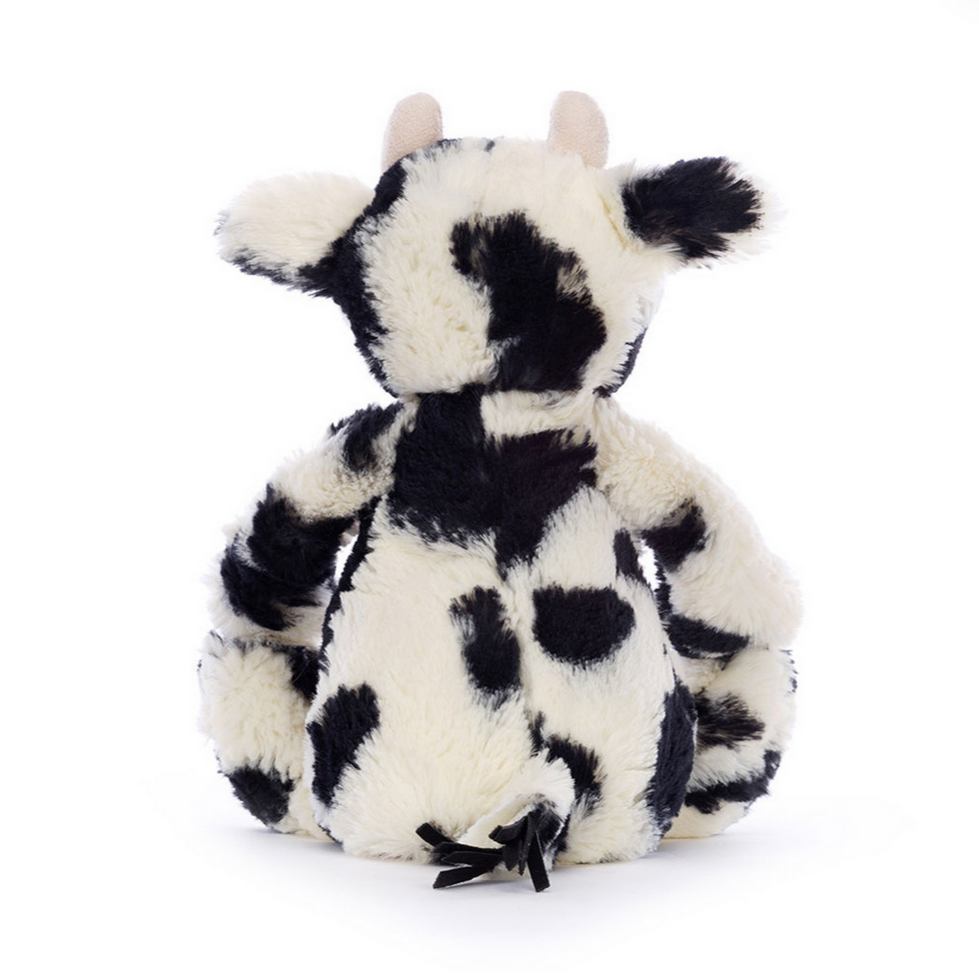 Plush toy cow named 'Bashful Calf' on a white background