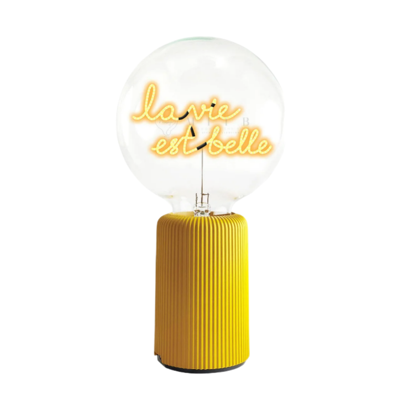 Decorative lamp with yellow ribbed base and 'L'amour est belle' text on a white background