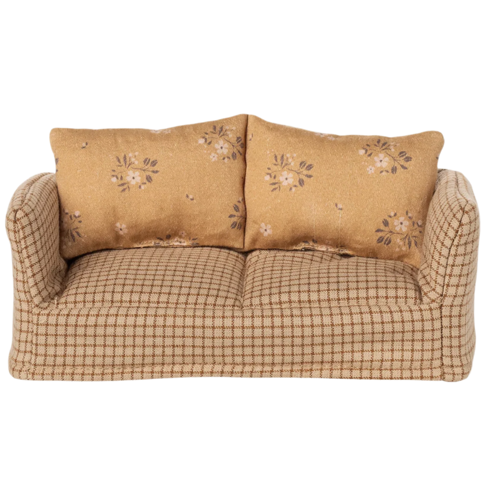 Beige sofa with floral-patterned cushions on a white background