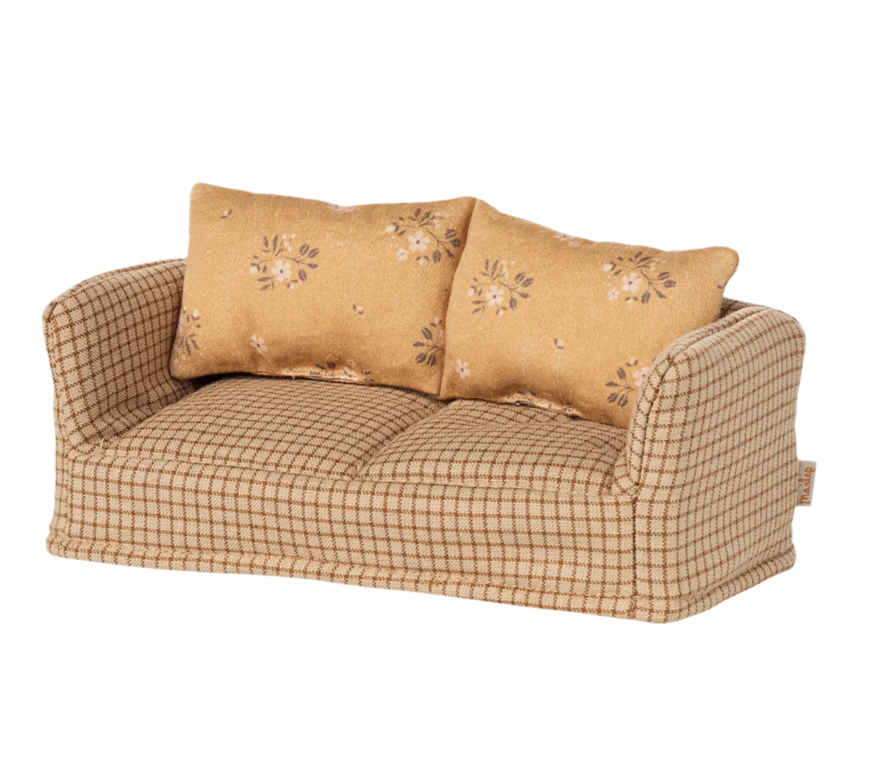 Beige checkered sofa with floral-patterned cushions on a white background