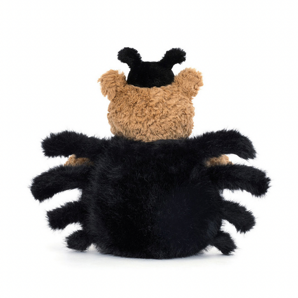 Toy bear shaped like a spider on a white background
