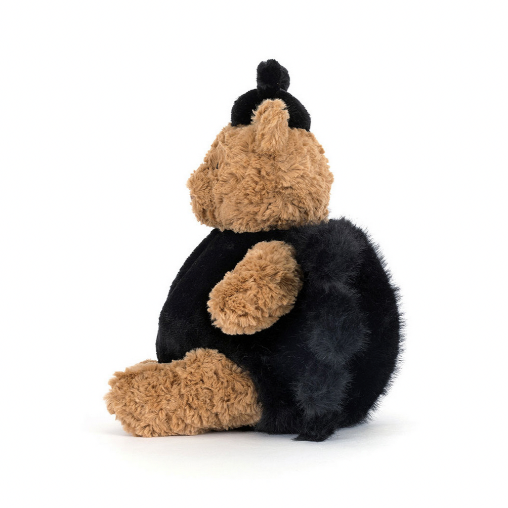Plush toy shaped like a bear with a black body and brown paws and face on a white background