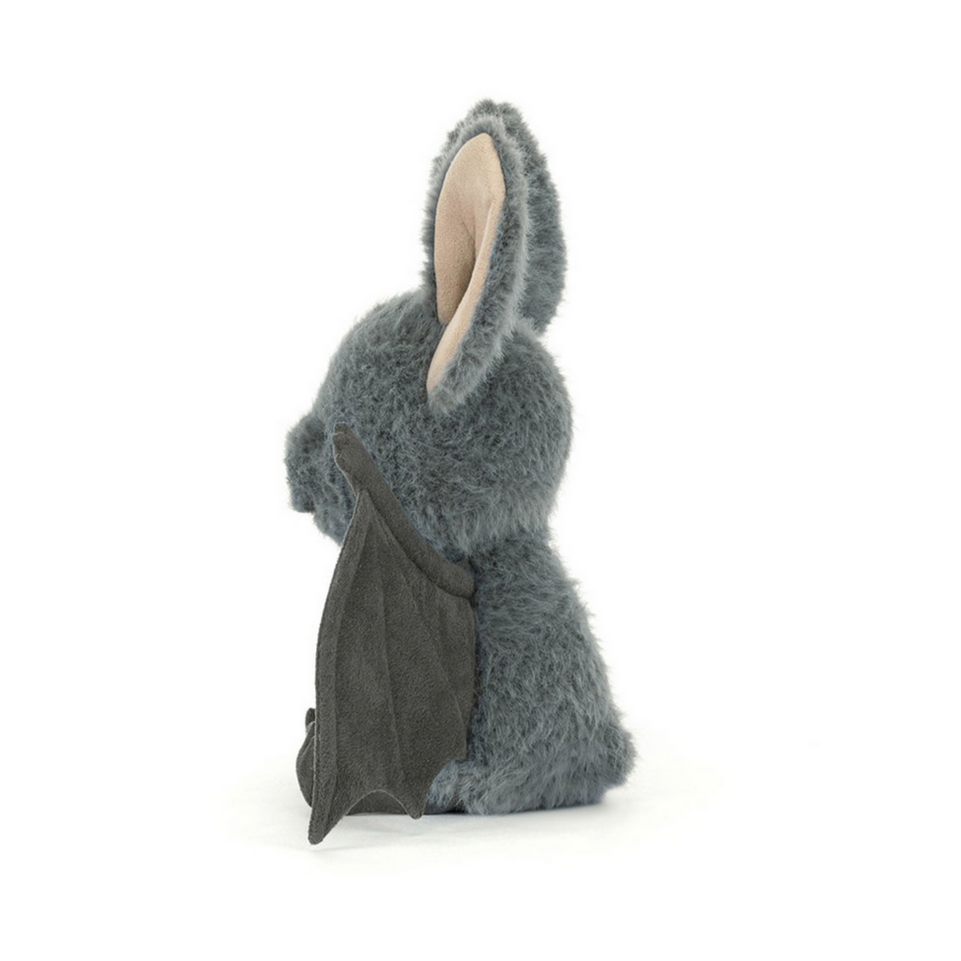 Gray plush bat on a white background