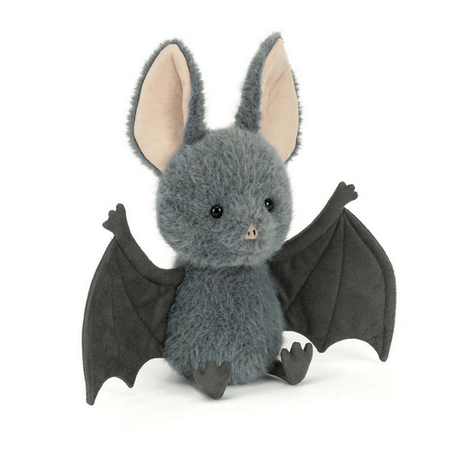 Stuffed bat toy with gray body and black wings on a white background