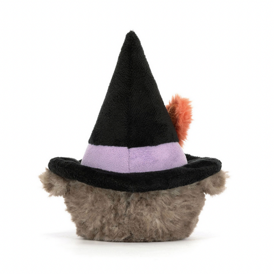 Small plush toy with a witch hat on a white background