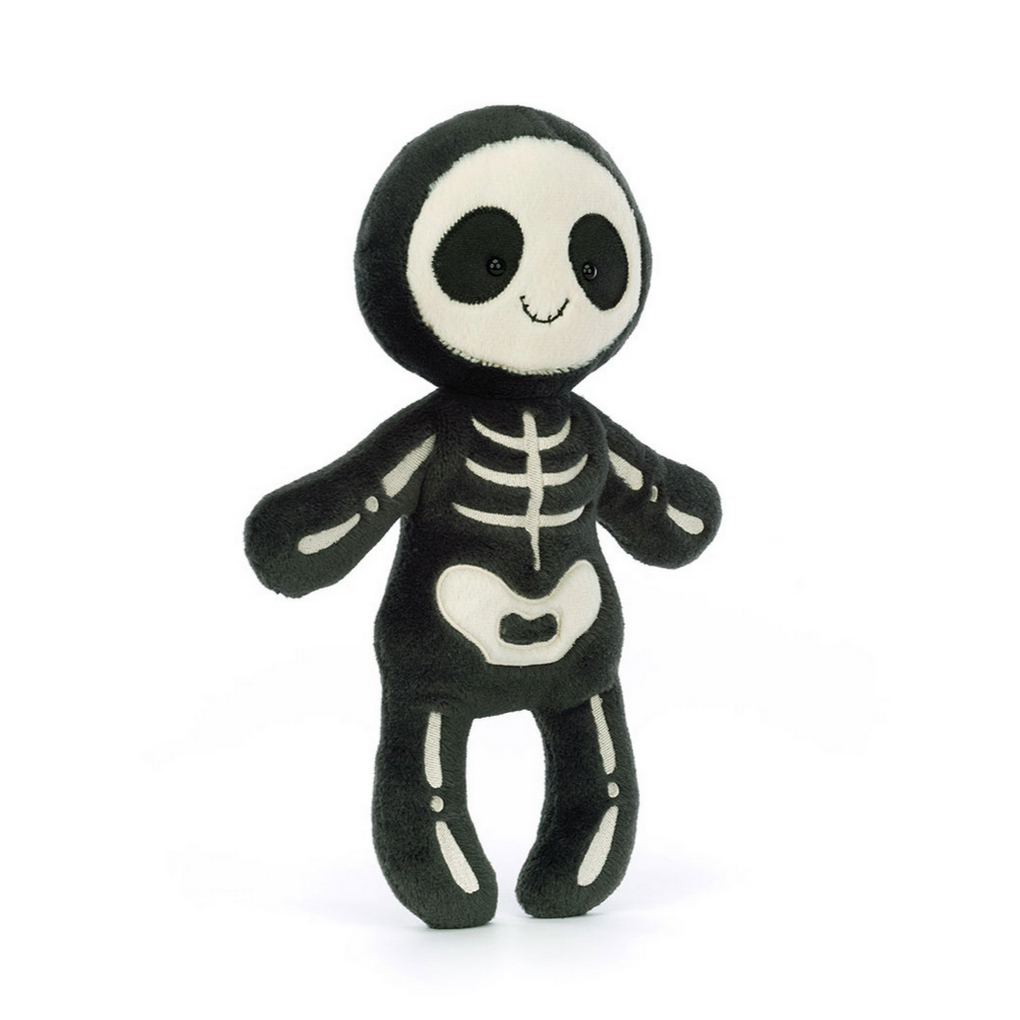 Skeleton plush toy on a white background