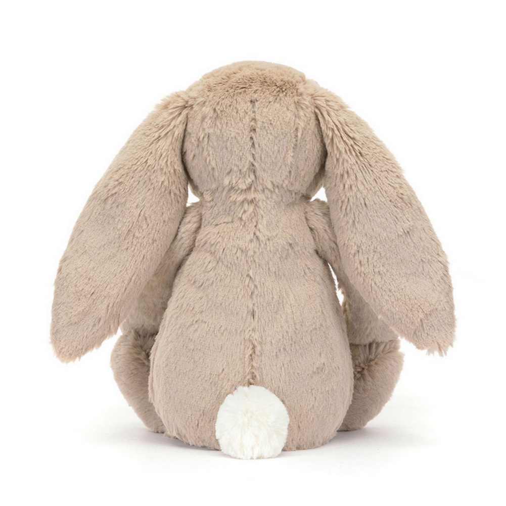 Beige bunny plush toy on a white background