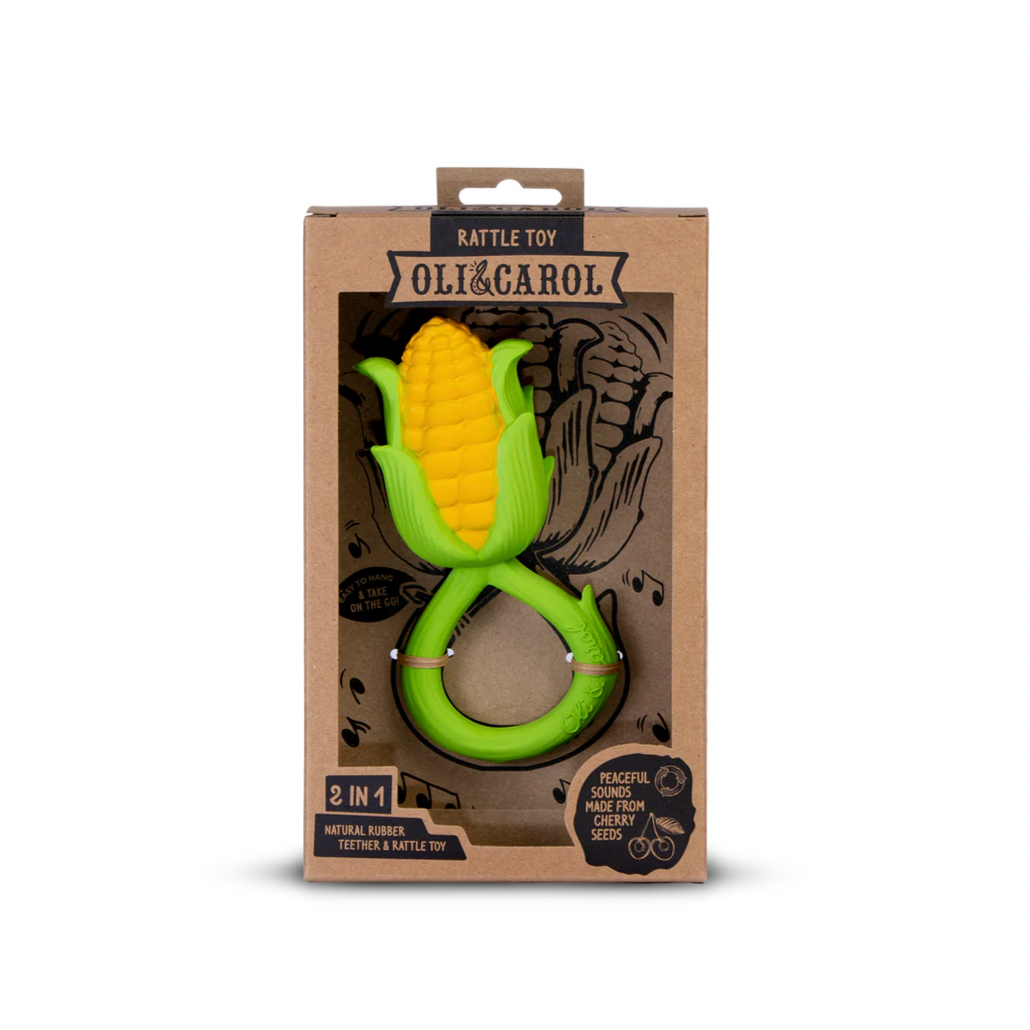 Corn-shaped toy in a cardboard packaging with 'Oli & Carol' branding on a white background.